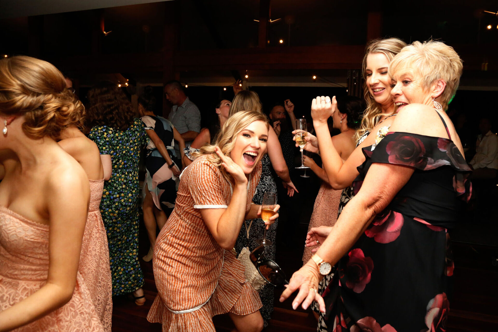 Guests dance at wedding reception